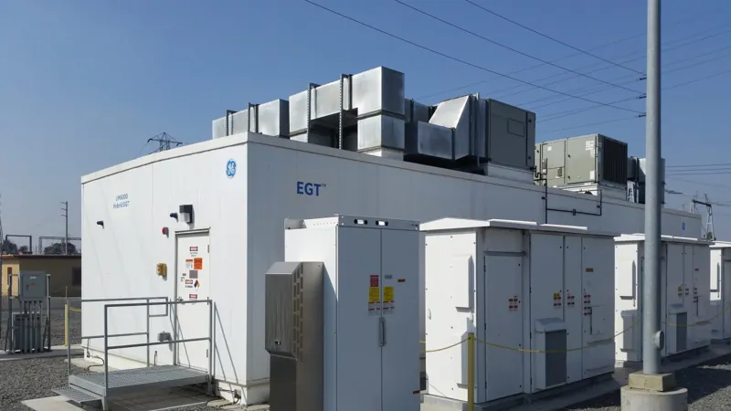 Battery storage containers beside a field
